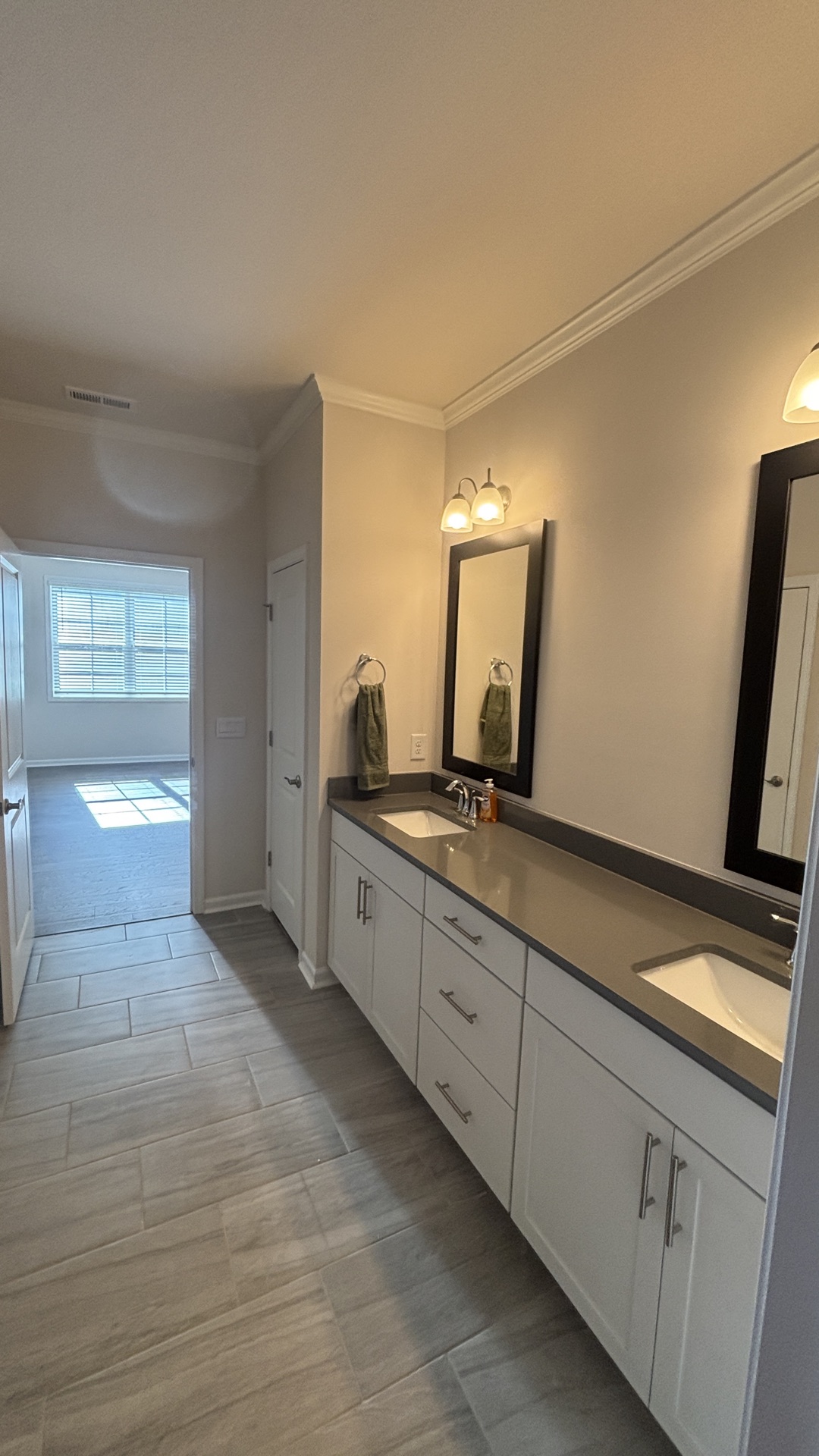 Bathroom refresh, Garner NC. New vanity, toilet, flooring, fixture updates.